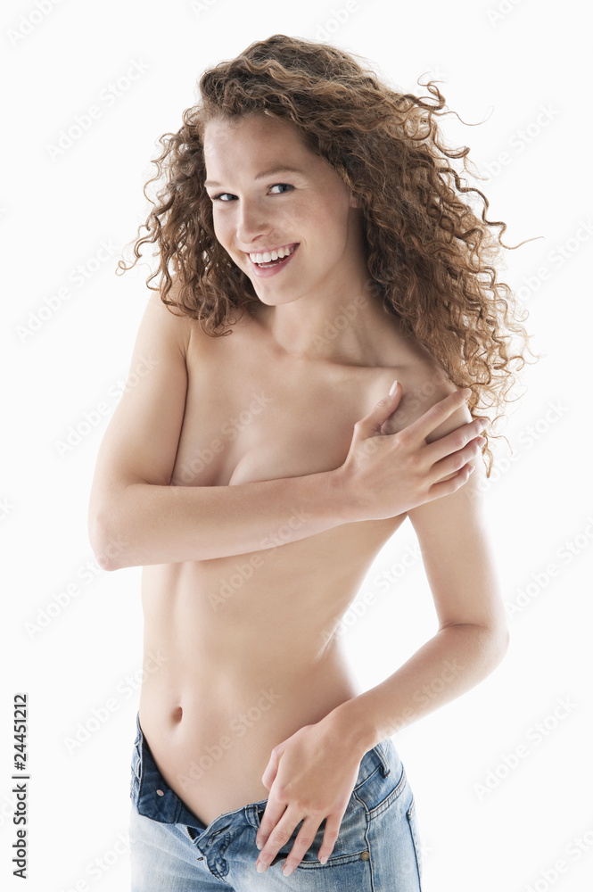 Fototapeta premium woman covering her breasts and smiling