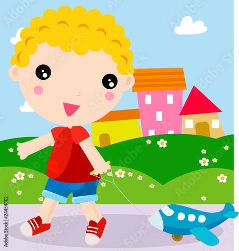 Little boy having fun, smiling and running with a toy airplane