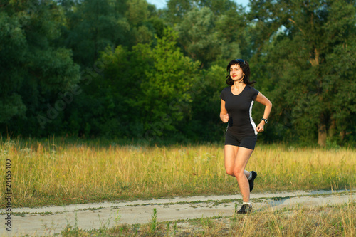 Woman jogging outdoors in forest