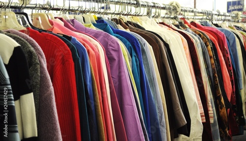 Row of different clothes on a rack © ingus25