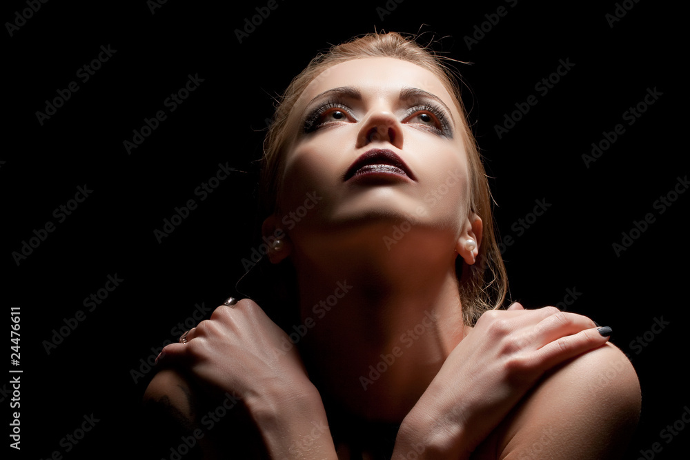 Young sensual woman in ray of light Young sensual woman in ray of light