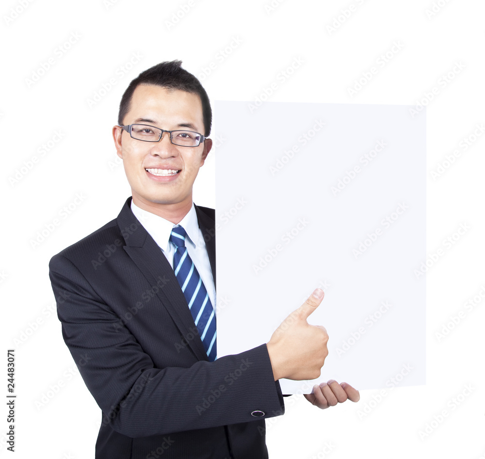 young businessman holding empty board and thumb up young businessman holding empty board and thumb up