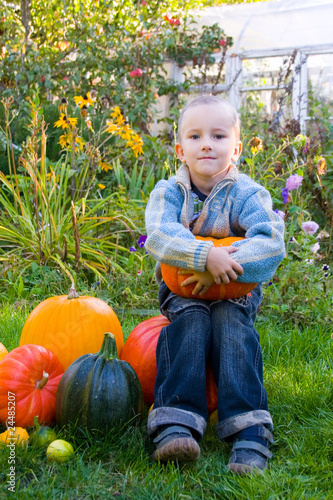 Happy boy with pumpkins