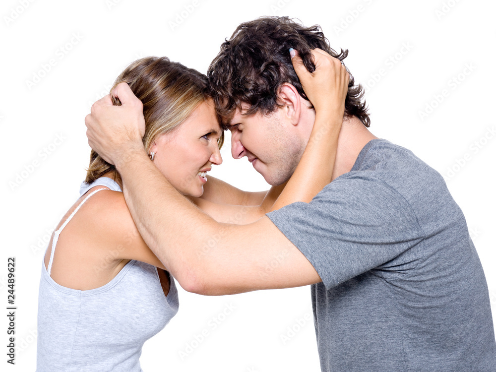 Portrait of the angry young couple - isolated on white Portrait of the angry young couple - isolated on white