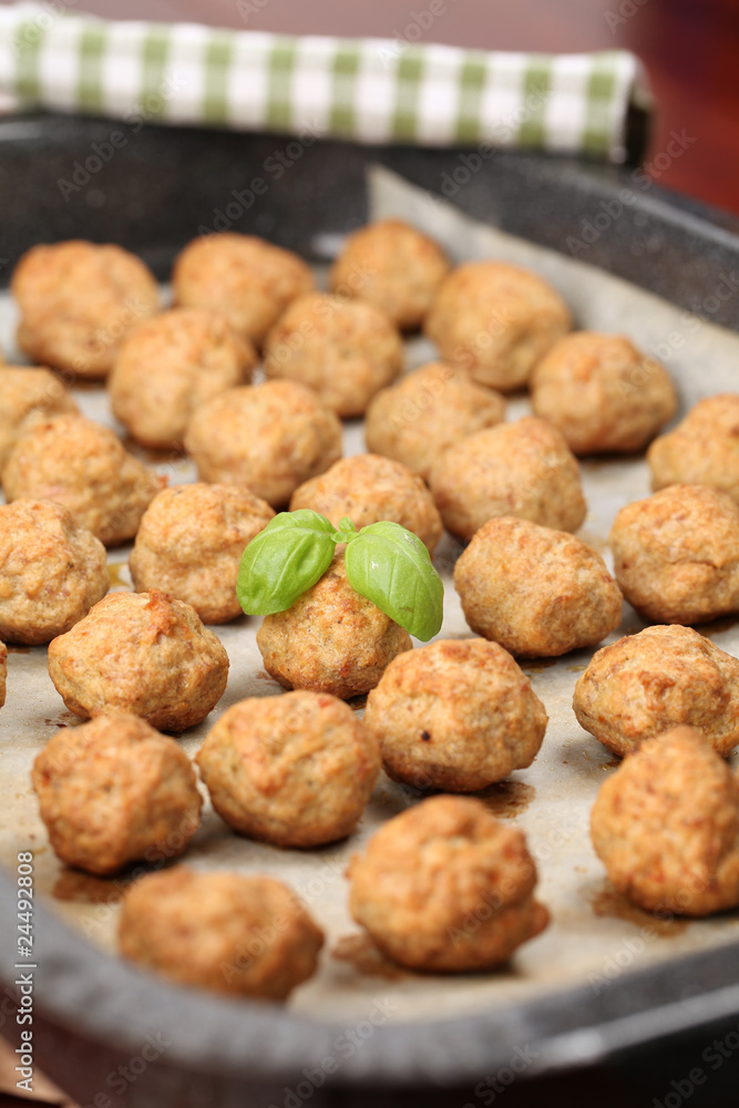 Roast meatballs on baking sheet. Shallow DOF Roast meatballs on baking sheet. Shallow DOF