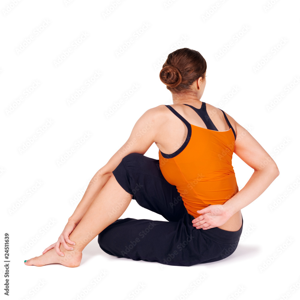 Woman Practicing Twist Pose Yoga Exercise Woman Practicing Twist Pose Yoga Exercise