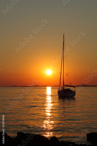 Gold romantic sunset with yacht © ArtushFoto