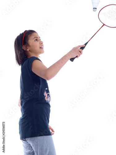 smiling girl playing badminton isolated on white background