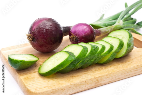 Green cucumber with slices and onion