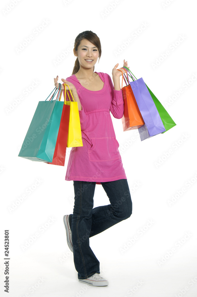 woman with shopping bags in hand