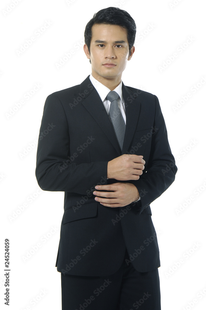 Portrait of businessman standing comfortably. Portrait of businessman standing comfortably.
