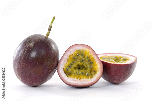 passion fruit , cut open on white photo