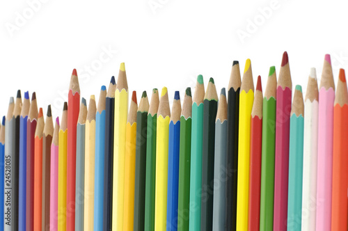 Assortment of coloured pencils with shadow on white