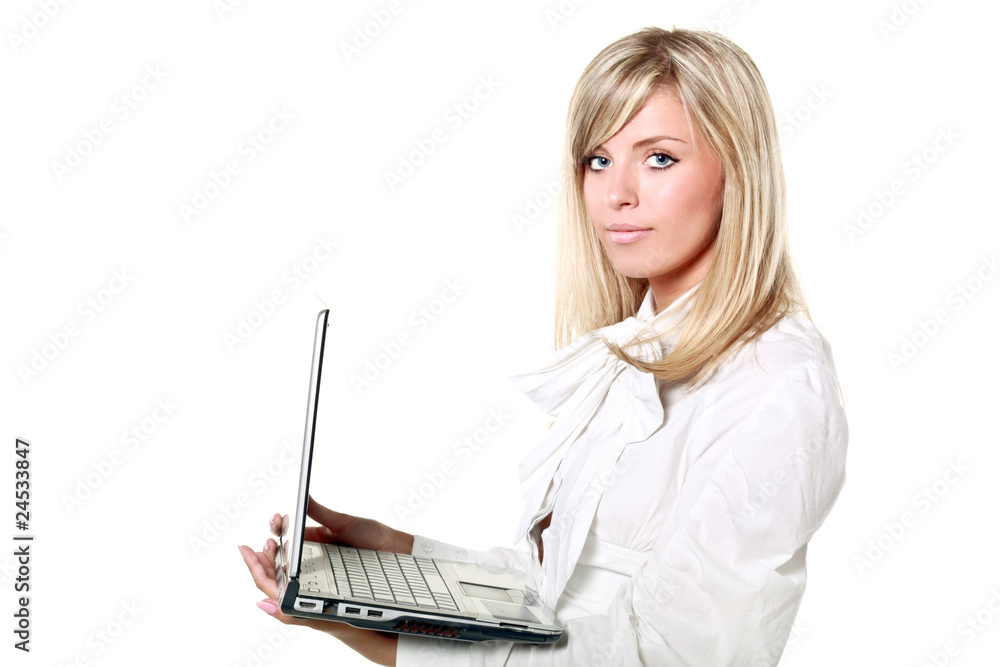 Young elegant blond buisinesswoman holding a laptop Young elegant blond buisinesswoman holding a laptop