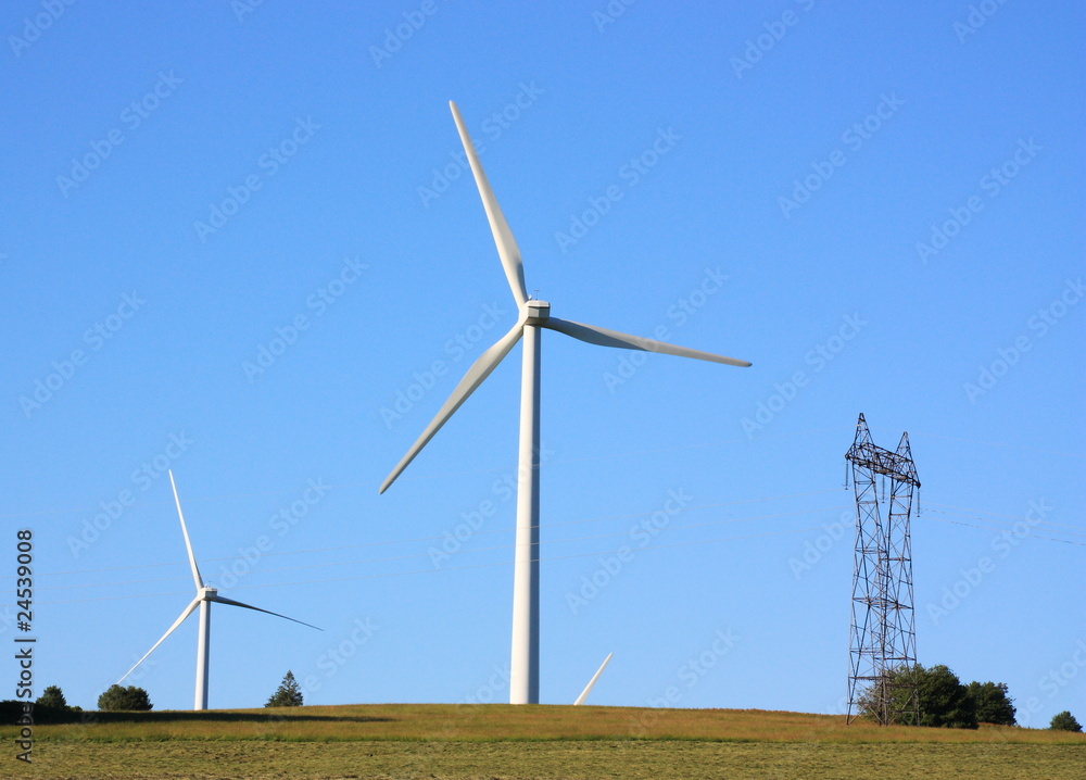 Wind Turbines and Electricity Pylon in evening light