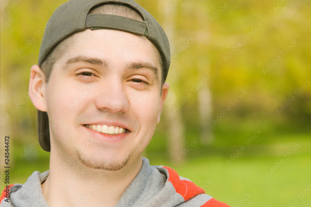 Smiling Casual young male in park Smiling Casual young male in park