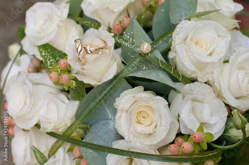 two wedding golden rings in bouquet