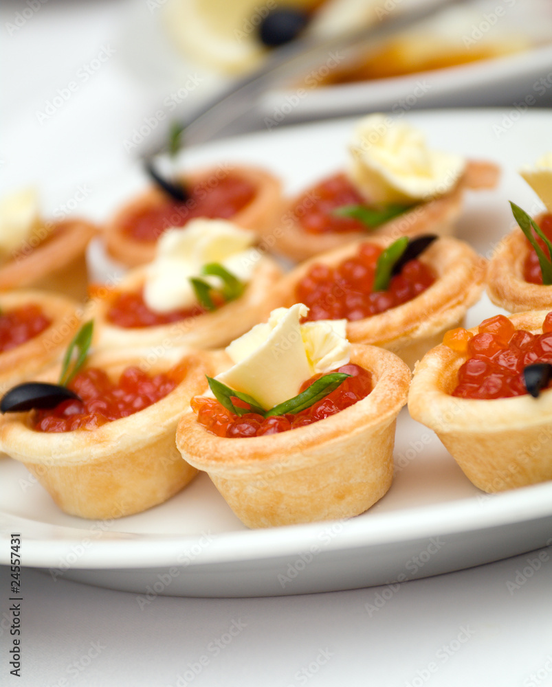 Canapes with red caviar   .