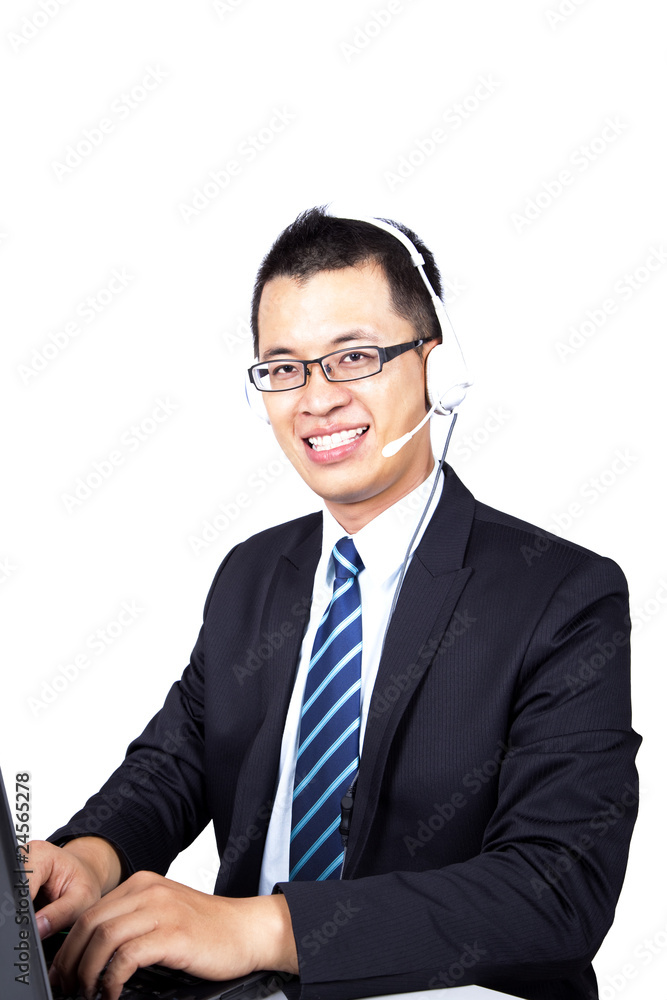 businessman working on computer and answer phone call businessman working on computer and answer phone call