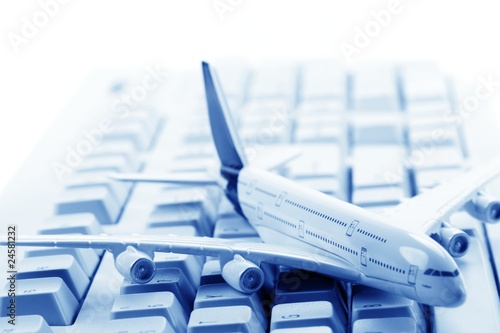 Model plane on computer keyboard