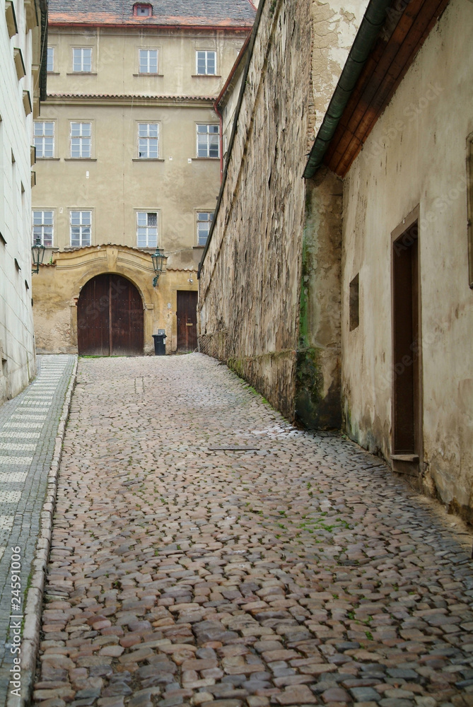 Narrow alley between tenement houses in Prague.