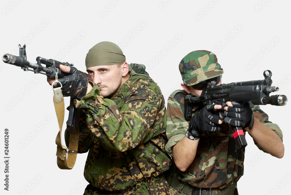 Fototapeta premium Portrait of soldiers with an automatic assault rifles