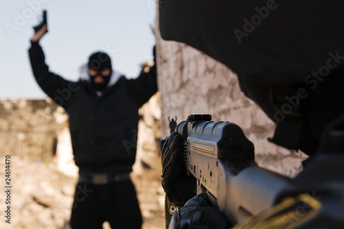 Soldier arresting armed criminal