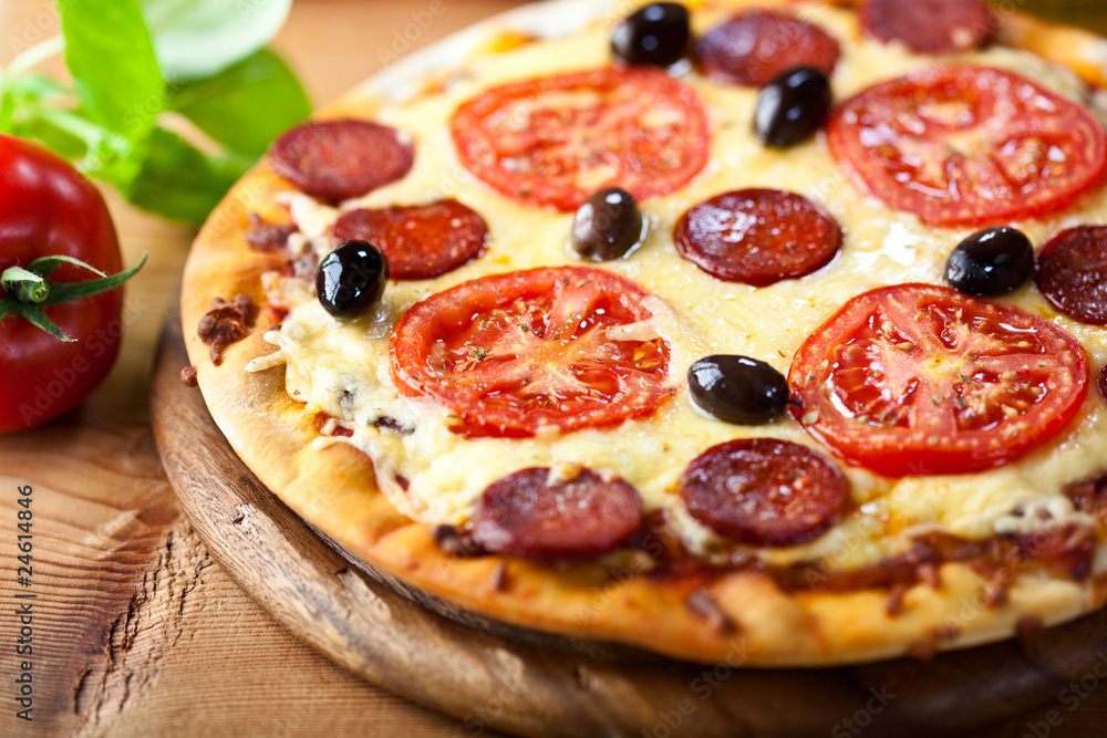 Rustic stonebaked pizza with chorizo salami Rustic stonebaked pizza with chorizo salami