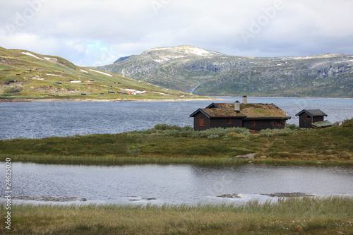 Traditional norwegian house in the rugged landscape.