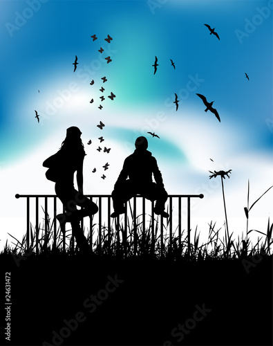 Boy and girl are sitting on fence outdoor, summer meadow