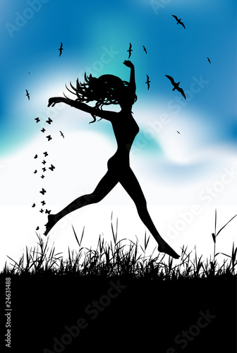 Young woman running on summer meadow