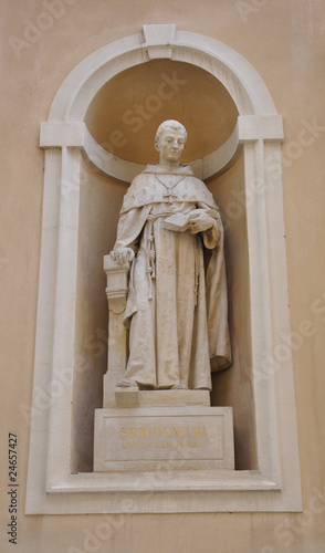 Statue embedded in cathedral wall