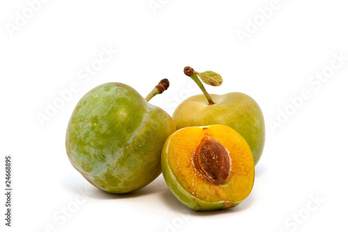 Plums on white background