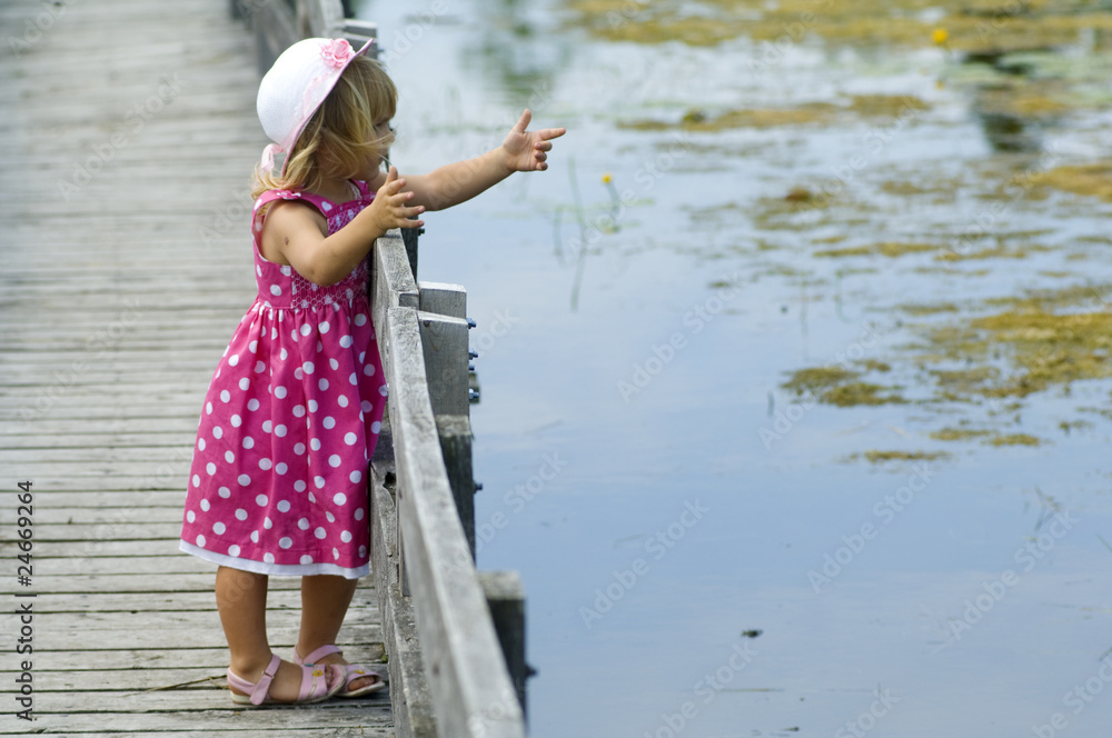 Little blond girl on boardwalk Little blond girl on boardwalk