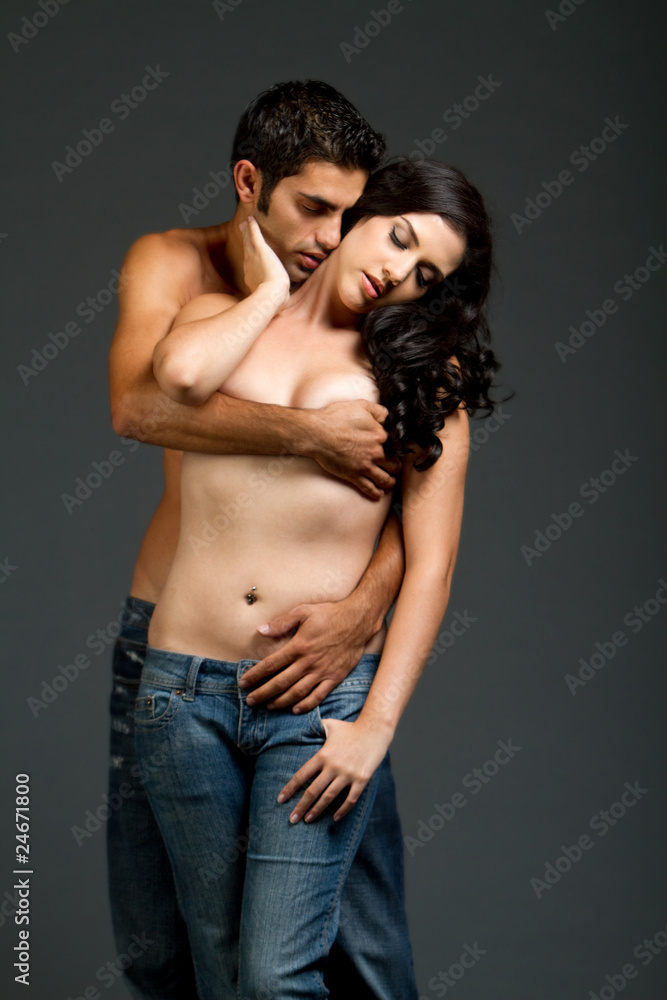 Sexy young multiracial couple with blue jeans Sexy young multiracial couple with blue jeans