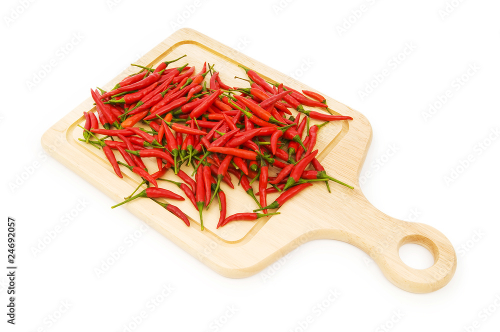 Pepper and cutting board isolated on the white Pepper and cutting board isolated on the white