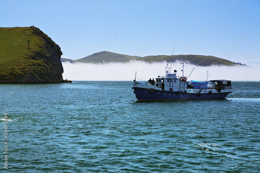 Boat in the Small Sea Strait of Lake Baikal Boat in the Small Sea Strait of Lake Baikal