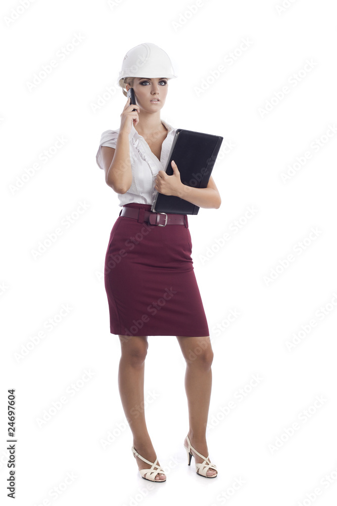 young woman holding some documents and talking at the phone young woman holding some documents and talking at the phone