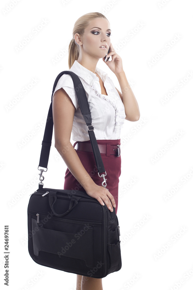 young woman with a shoulder bag and talking at the phone young woman with a shoulder bag and talking at the phone