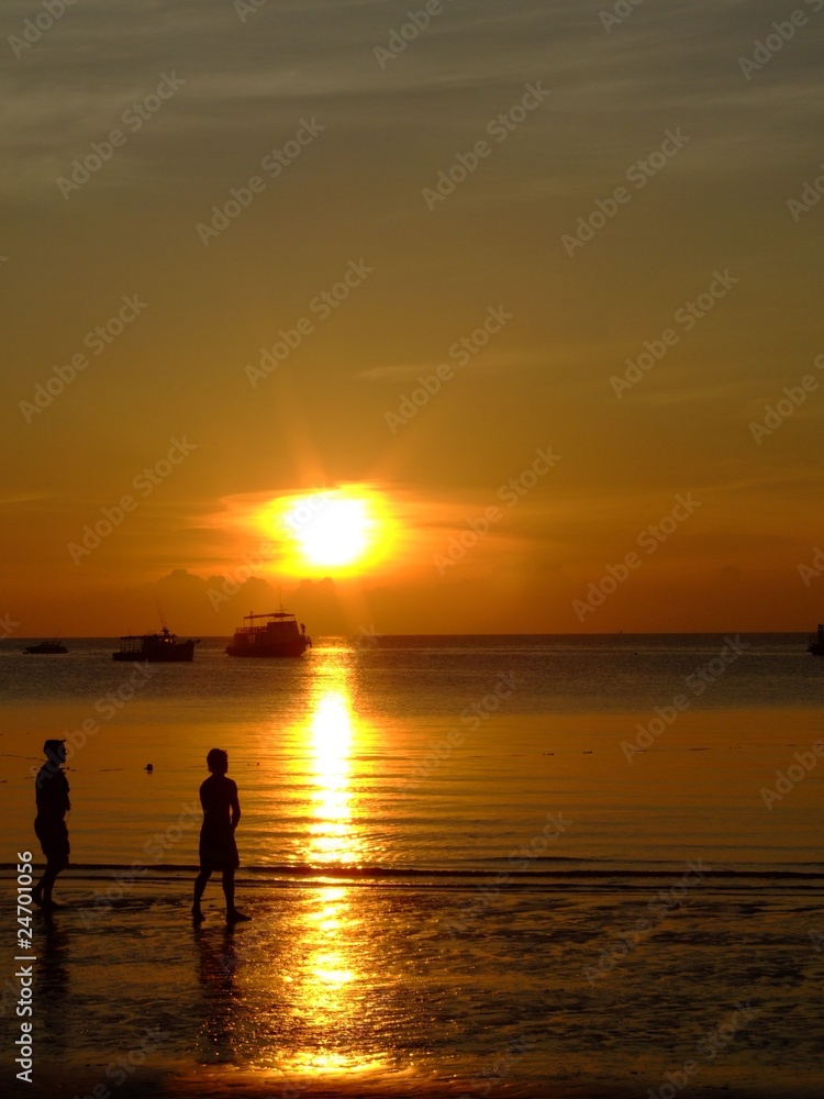 Gold sunset over beach, Thailand.