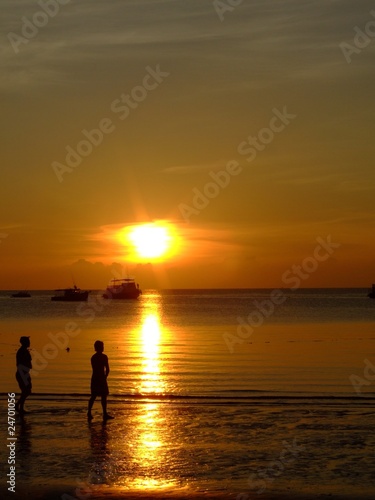 Gold sunset over beach, Thailand.