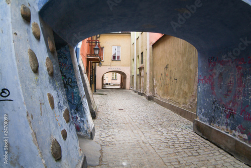 Archway at tenement house at Warsaw's old town. #24701099