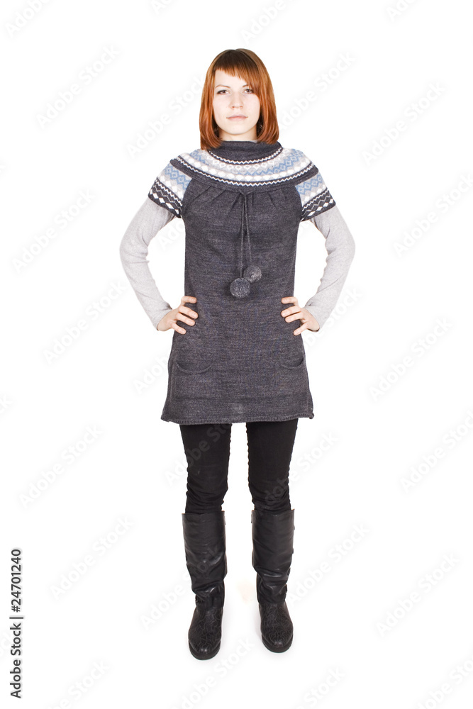 young beautiful girl in knit dress standing, hands on hips, full young beautiful girl in knit dress standing, hands on hips, full
