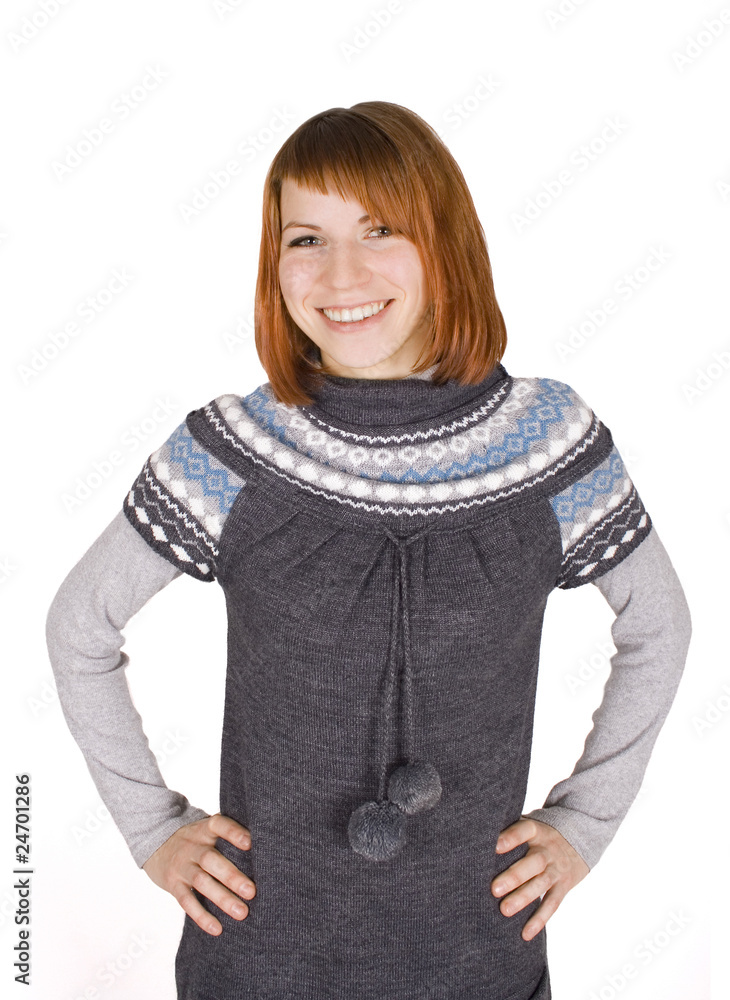young beautiful girl in knit dress standing, hands on hips, half young beautiful girl in knit dress standing, hands on hips, half