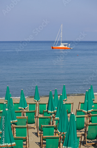 beach chaires with sailship photo