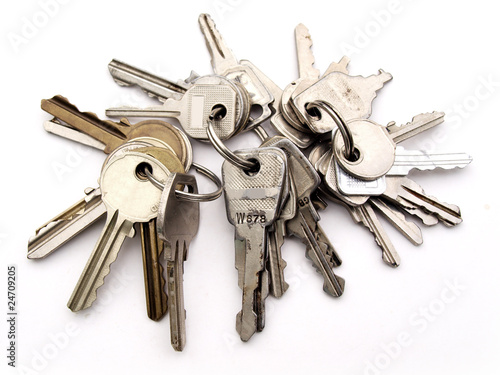 Three sets of keys on rings on white