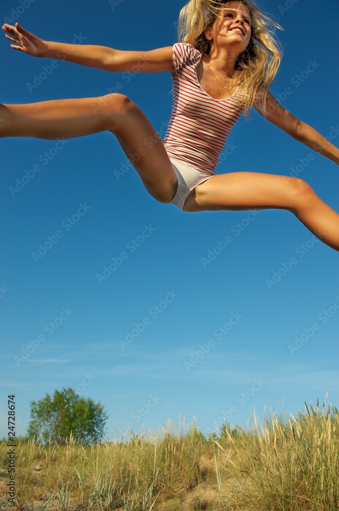 Happy little girl jumping Happy little girl jumping