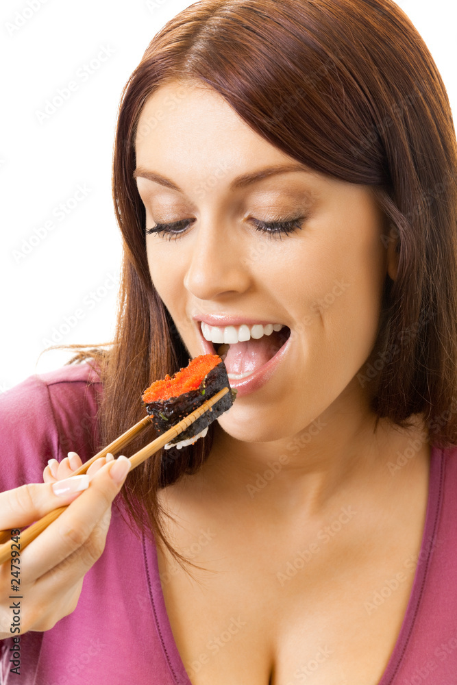 Young happy woman eating sushi roll by chopsticks, isolated Young happy woman eating sushi roll by chopsticks, isolated