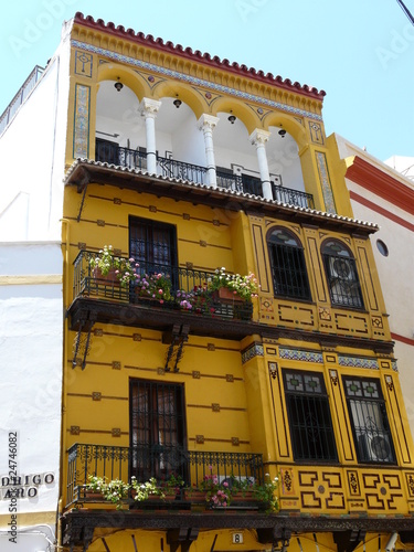 Colorful houses in the backstreets of Seville, Spain photo