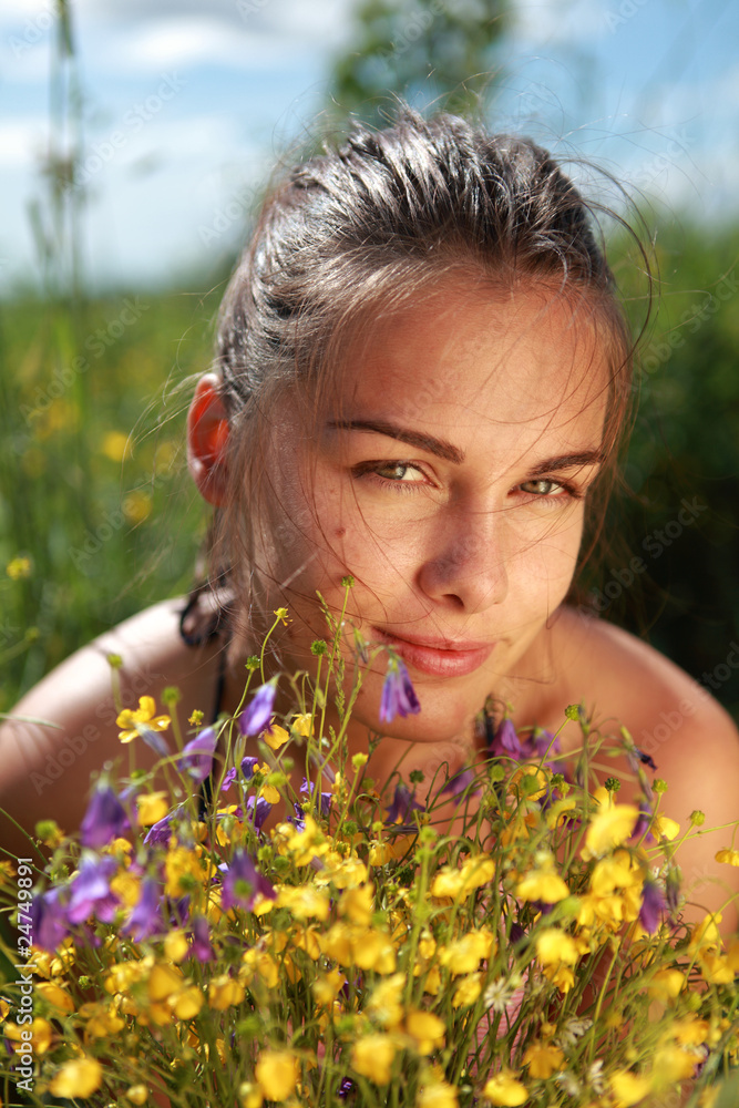 Portrait of a beautiful girl lays on a grass Portrait of a beautiful girl lays on a grass